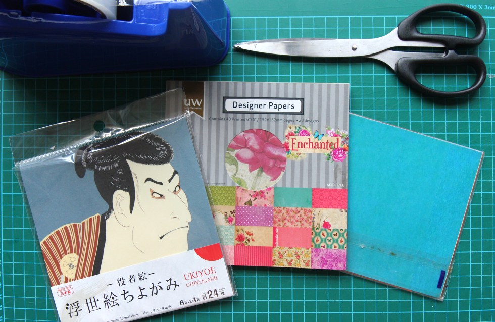 Finished polaroid-style photo sleeves made from patterned origami paper