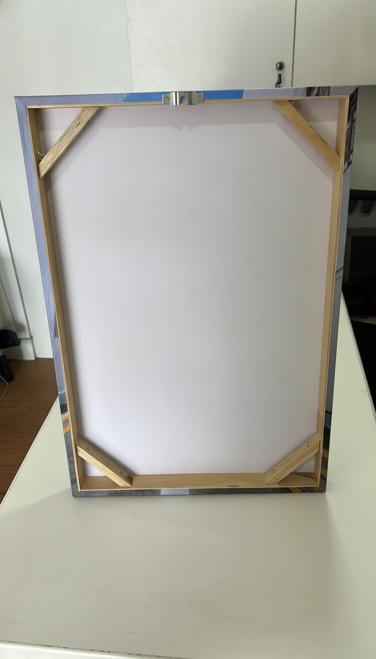 Back of a KT Colour canvas: solid wood stretcher bars, corner braces and hanging bracket