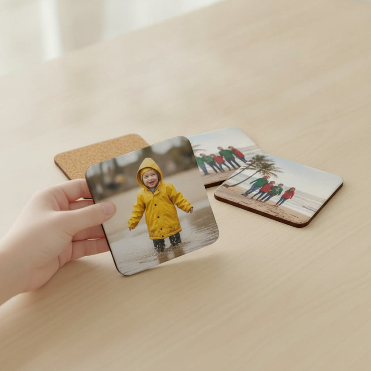 Close-up of a photo coaster showing the printed top and cork back