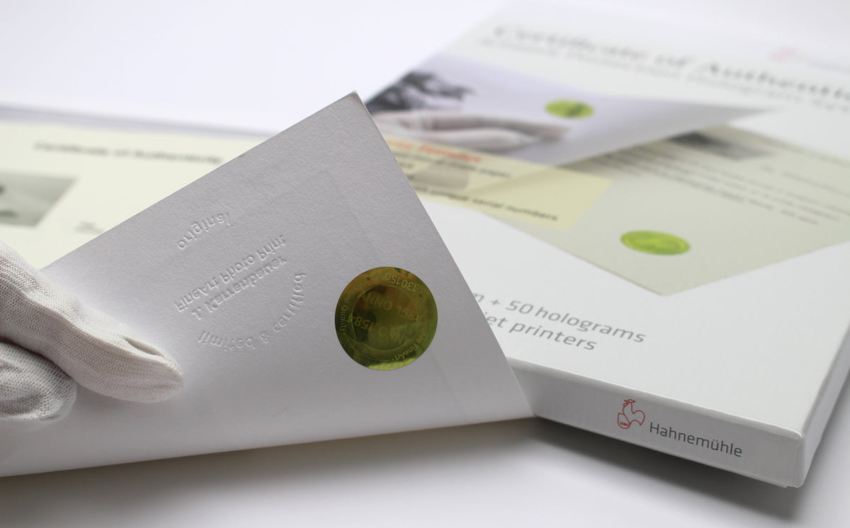 Hahnemühle Certificate of Authenticity being filled in next to a fine art print, image from Hahnemühle