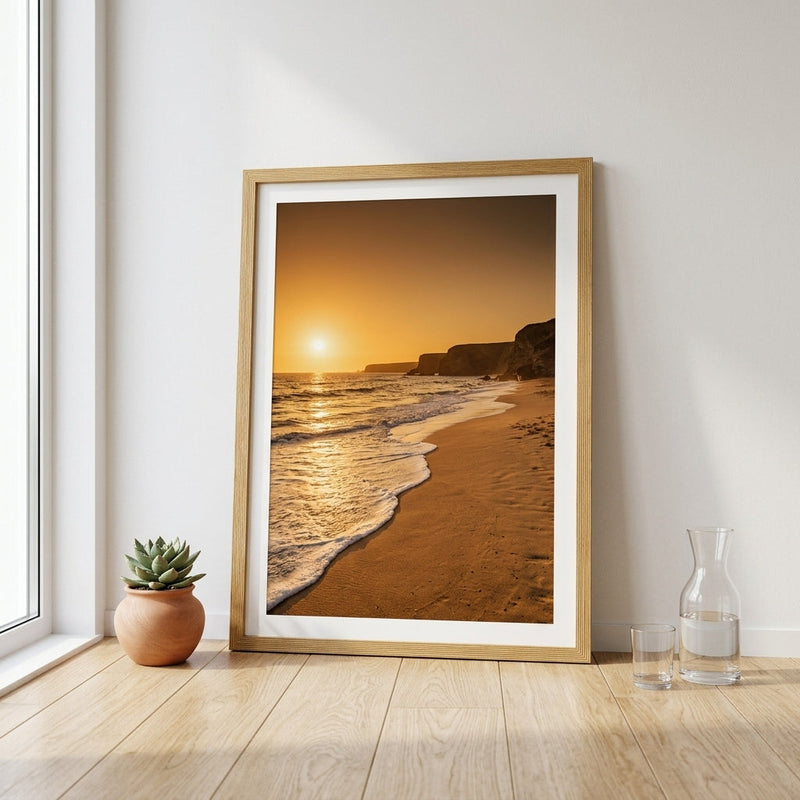 Medium framed poster in a slim oak wood frame leaning against a wall