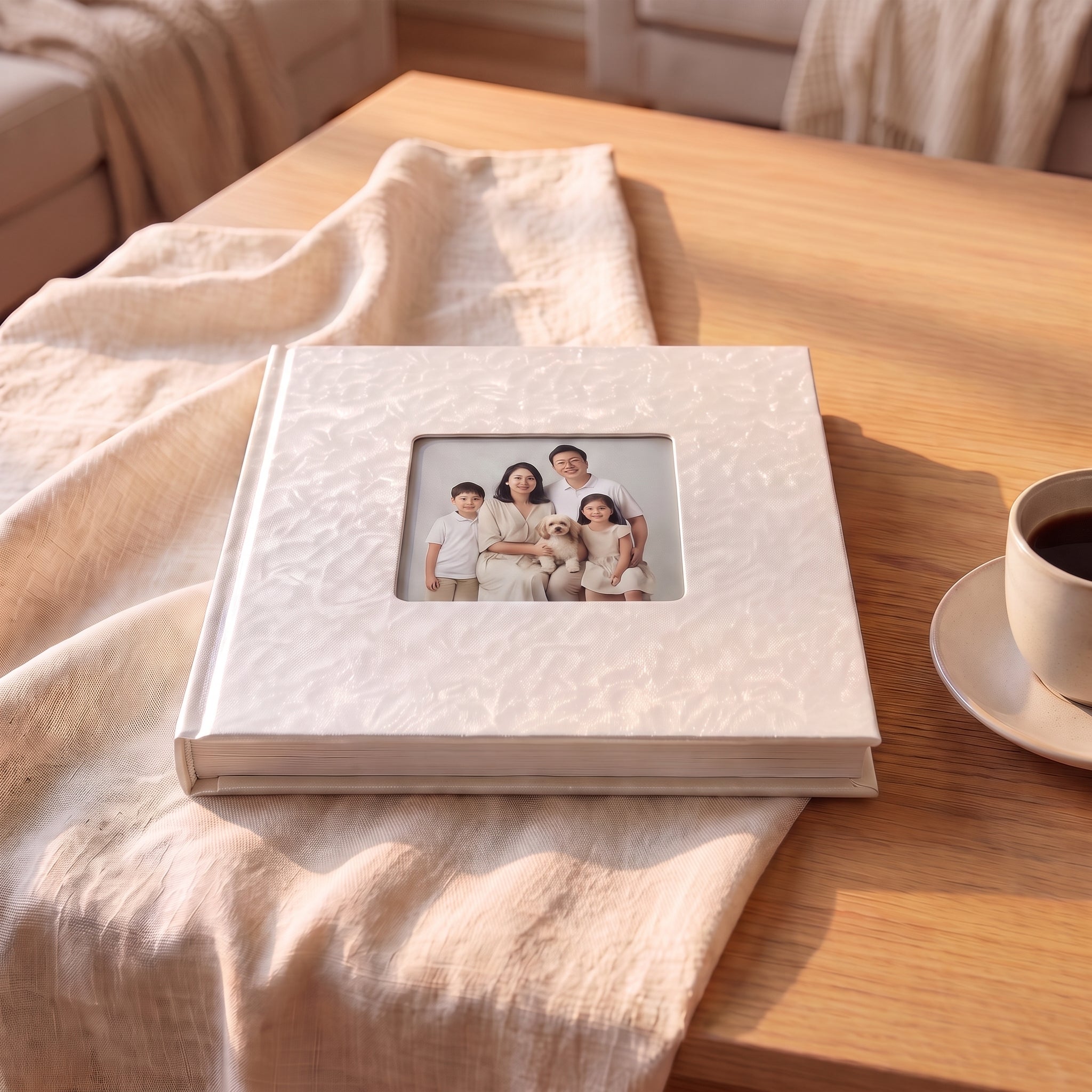 Lay-flat photo book with pearl vinyl cover on a coffee table