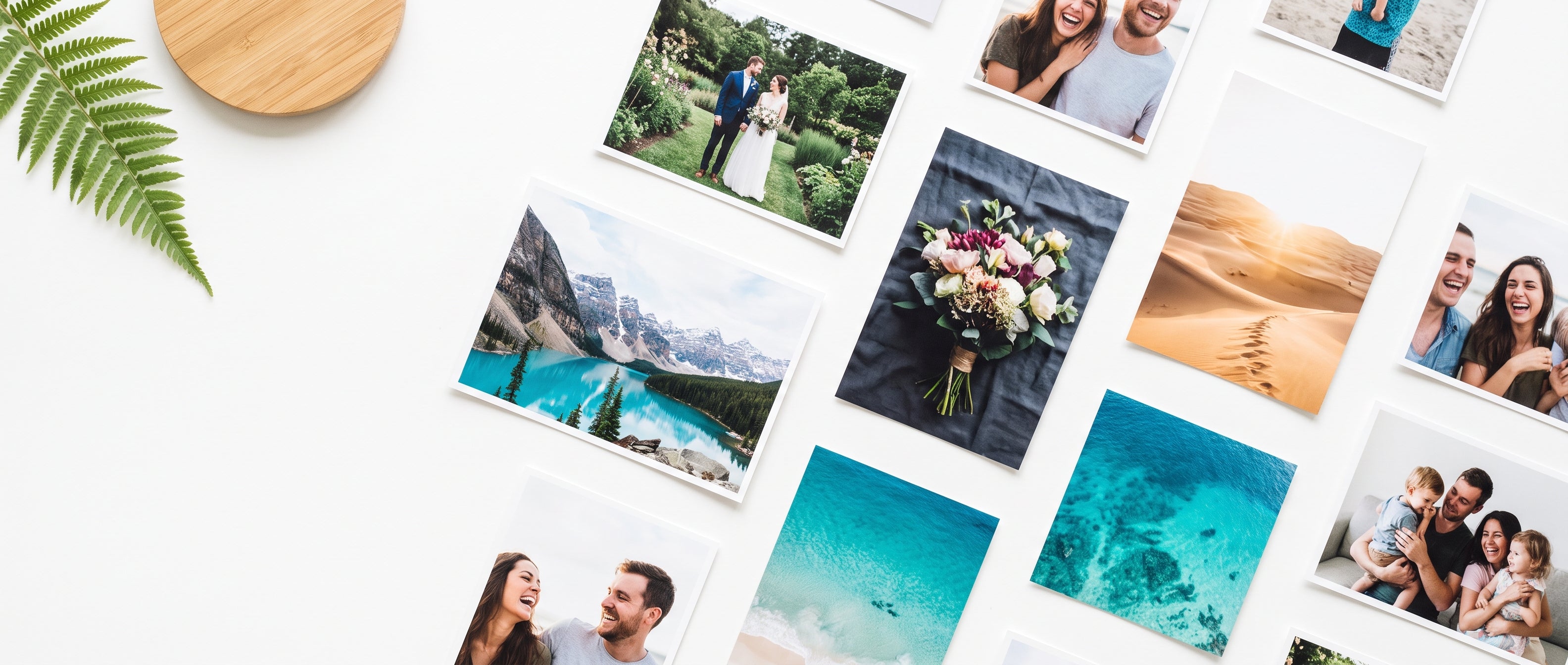 Scattered photo prints laid flat on a white table - photo printing in Singapore